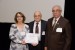 Dr. Nagib Callaos, General Chair, giving Dr. Magali Maria de Araújo Barroso and Prof. Leonidas Conceição Barroso the best paper award certificate of the session "Aplicaciones y Tópicos Relacionados I." The title of the awarded paper is "Estudos Interdisciplinares no Vale do Mucuri – Brasil."